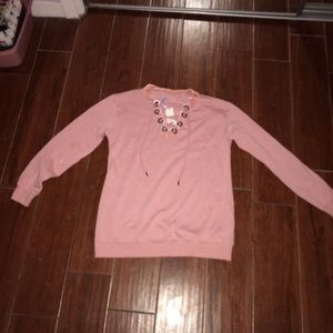 Francesca’s pink sweatshirt